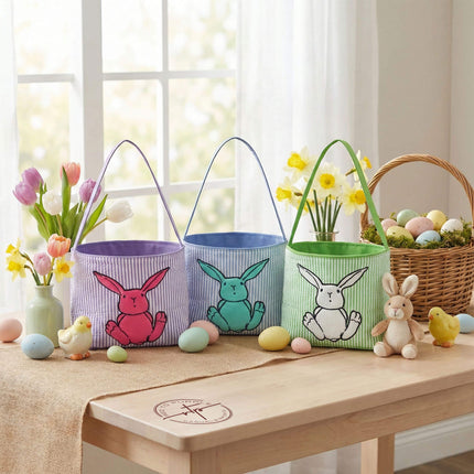 Red To Purple bunny applique Easter baskets with custom name embroidery, styled on a wood desk with Easter eggs