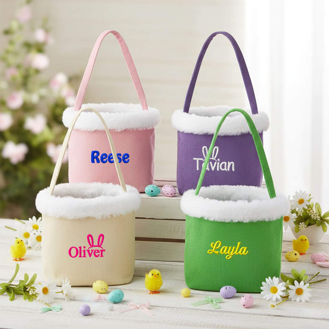 Red To Purple personalized corduroy Easter baskets with custom name embroidery, styled on a white fluffy rug with Easter eggs