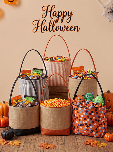 Six Halloween-themed fabric storage baskets filled with candy and treats, arranged on a wooden floor