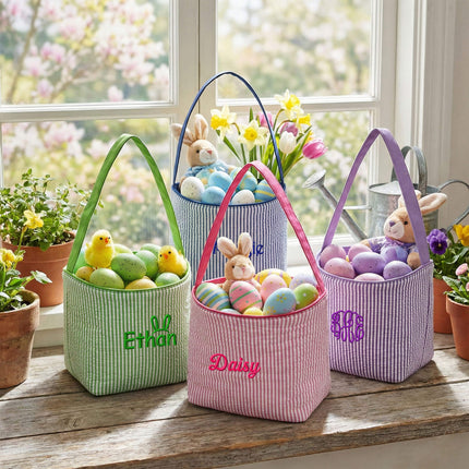 Red To Purple personalized seersucker Easter baskets with custom monograms, styled on a windowsill with Easter eggs.