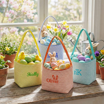 Red To Purple personalized seersucker Easter baskets with custom name embroidery, styled on a white fluffy rug with Easter eggs