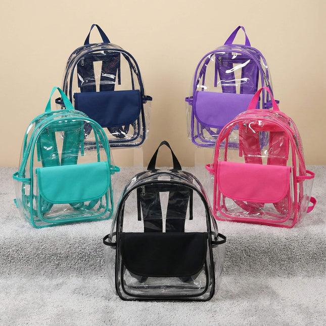 Red To Purple personalized preschool backpacks in clear PVC with a solid color flap pocket and trim, resting on a textured grey carpet.