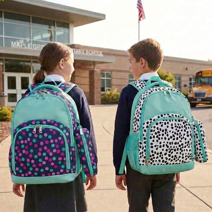Two children wearing patterned backpacks in front of a school building.