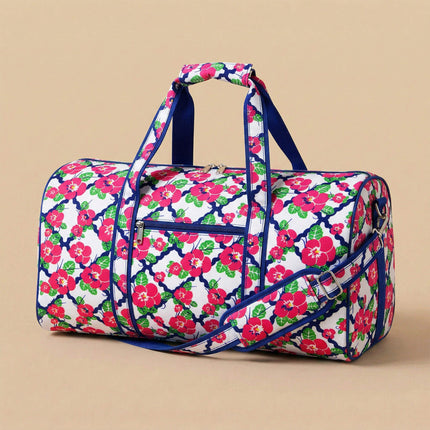 Wholesale large duffel bag with hot pink balsamine print, featuring navy trims.