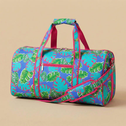 Wholesale large duffel bag with tropical leaves print, featuring hot pink trims.