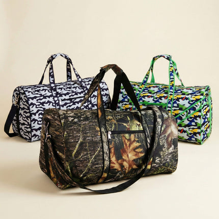 Three duffel bags with different camouflage patterns on a beige background
