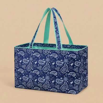 Large navy and white paisley printed waterproof carryall tote bag from Red To Purple Wholesale, ideal for shopping and beach use.