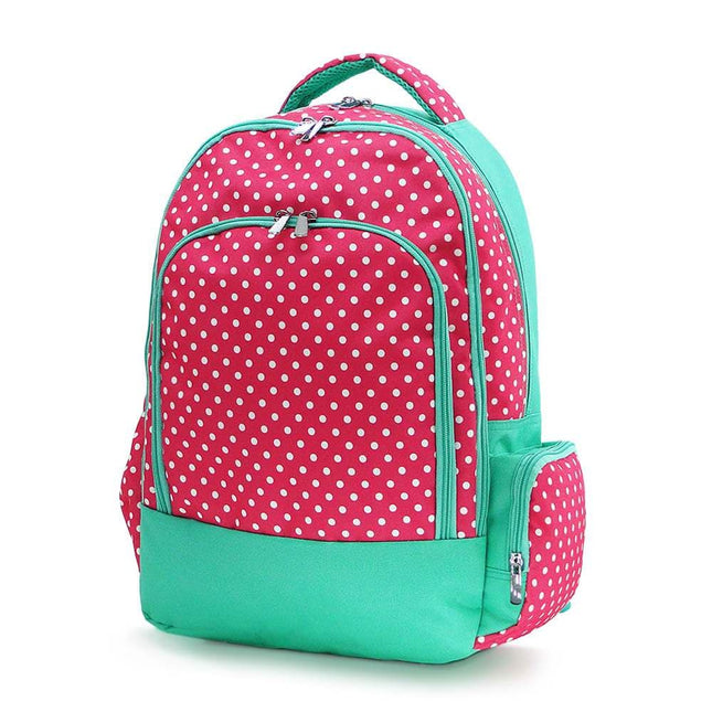Classic school backpack from Red To Purple Wholesale featuring a hot pink and white polka dot print with mint trim, ideal for students